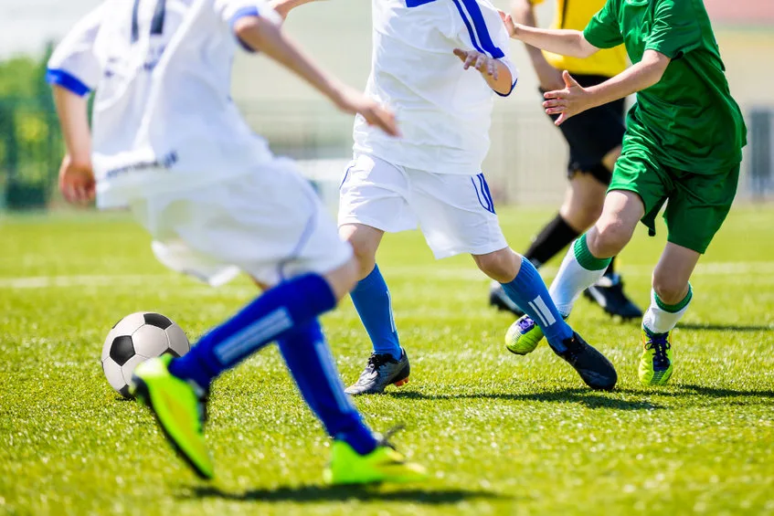 soccer tournament for youth teams. young boys playing football soccer match.